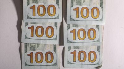 Six stacks of one hundred dollar bills